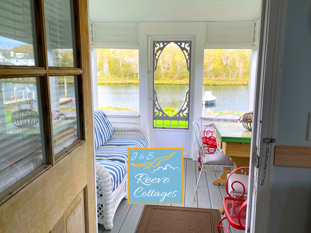 Premier Waterfront Cottage 2 Screened-In Porch on a warm day viewing the water of Reeves Creek